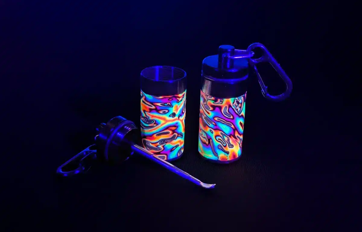 Rainbow uv stash box, blacklight close up with psychedelic pattern, lid open