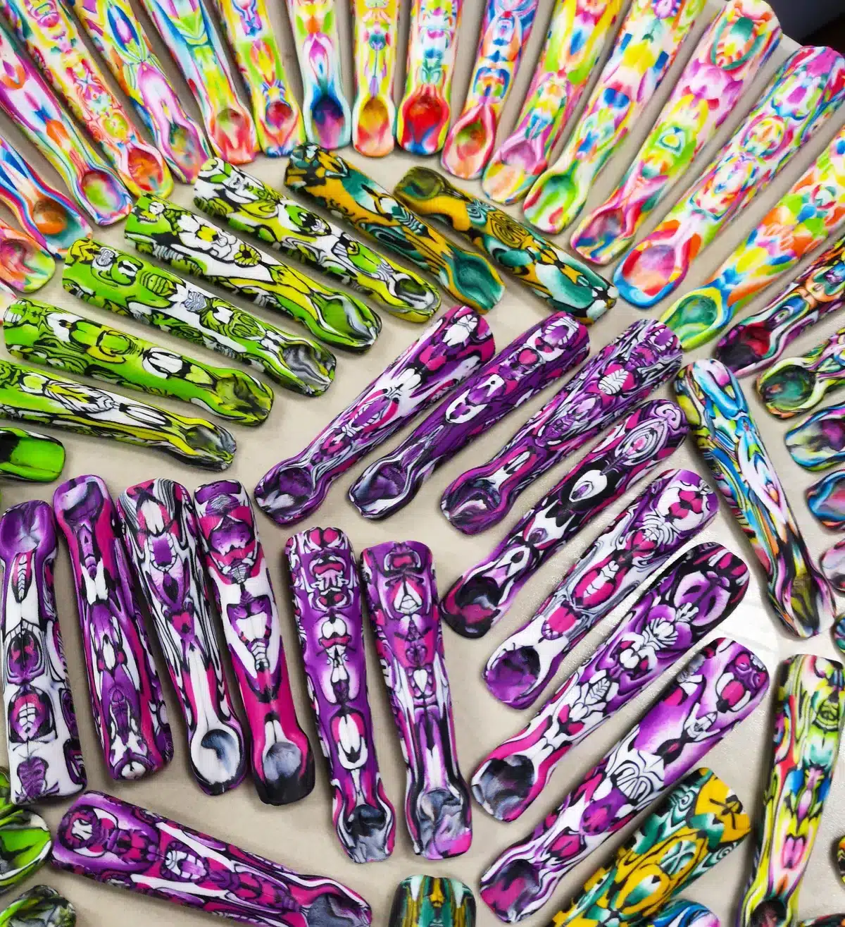 wide variety of bulk spoons displayed on a white background
