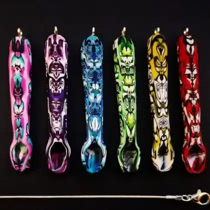 spoon pendant selection, psychedelic design with silver snakechain necklace