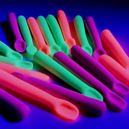 uv neon mini spoon selection closup under fluorescent blacklight
