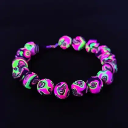 uv purple green bracelet with bright psychedelic pattern under uv light - psytrance jewelry