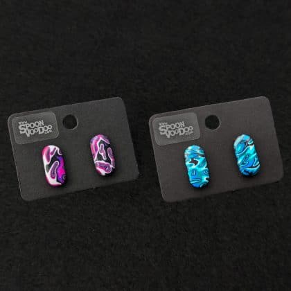 Psychedelic oval stud earrings in blue and purple close up primary image